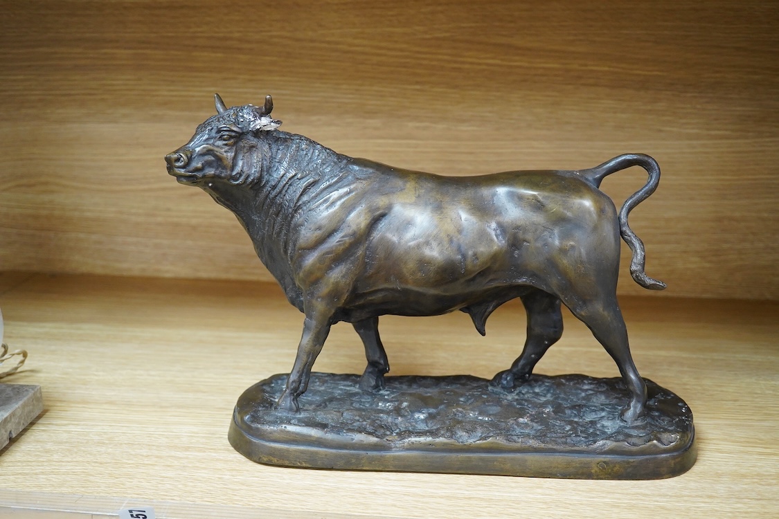 An Animalier style bronze model of a bull, unsigned, 33cm wide